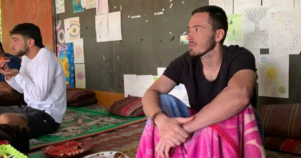 A man with a blanket